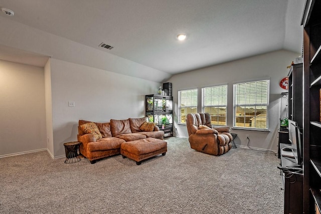 living room with vaulted ceiling and carpet