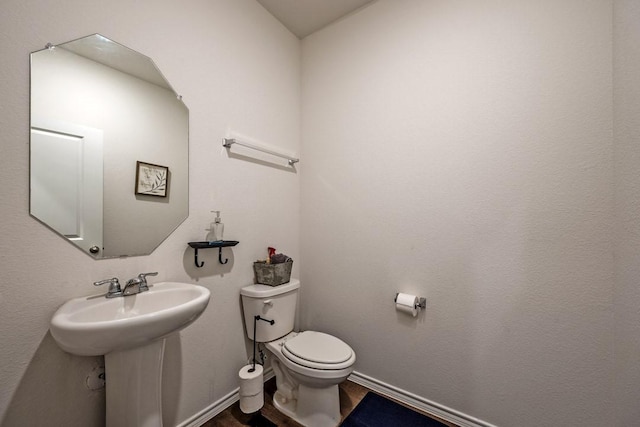 bathroom with sink and toilet