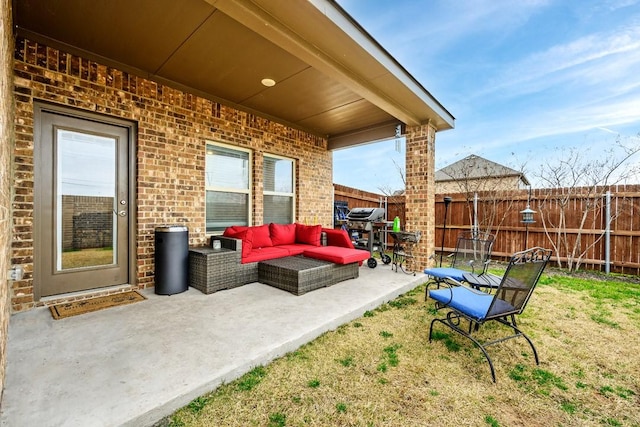 view of patio featuring outdoor lounge area and a grill