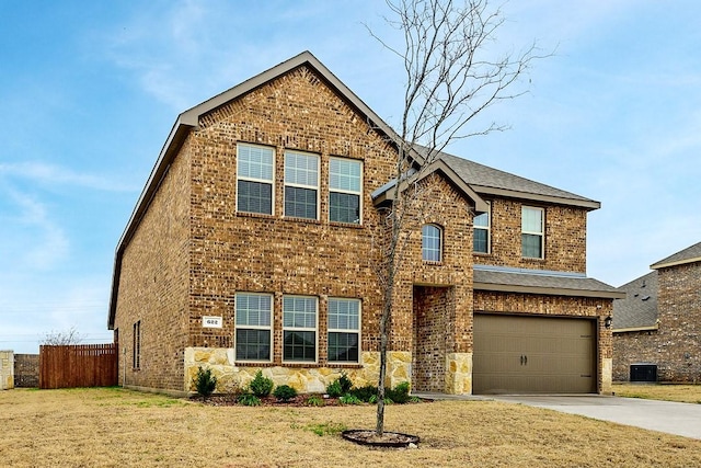 view of front of property with a garage and a front yard