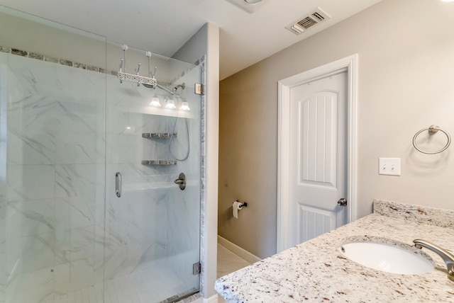 bathroom featuring vanity and walk in shower