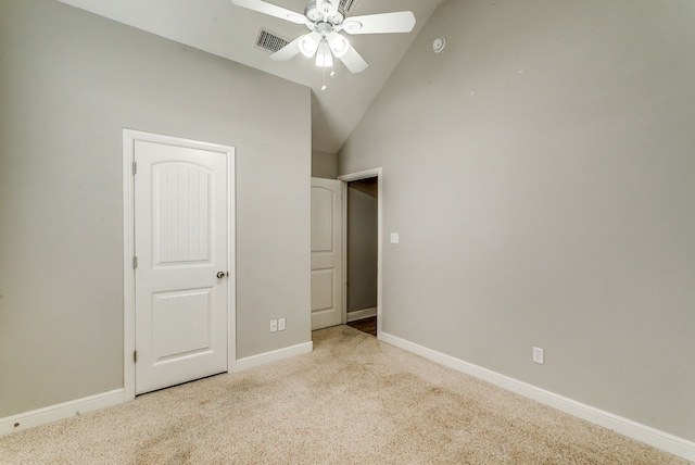 unfurnished bedroom featuring lofted ceiling, light colored carpet, and ceiling fan