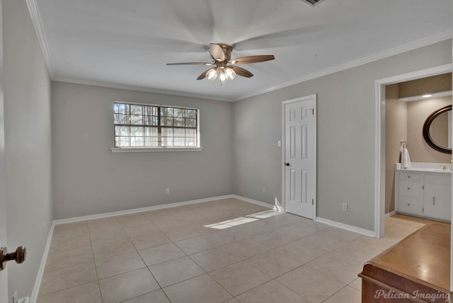 unfurnished bedroom featuring connected bathroom, light tile patterned floors, crown molding, and ceiling fan