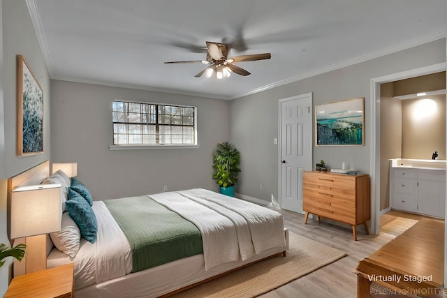 bedroom with light wood-style floors, connected bathroom, ornamental molding, and baseboards