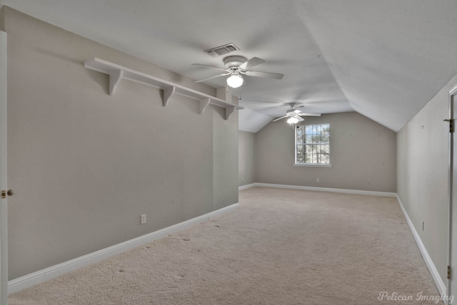 bonus room with lofted ceiling, light colored carpet, and ceiling fan