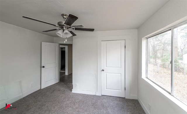 unfurnished bedroom with carpet floors and ceiling fan