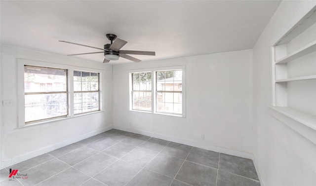 unfurnished room featuring tile patterned flooring, built in features, and ceiling fan