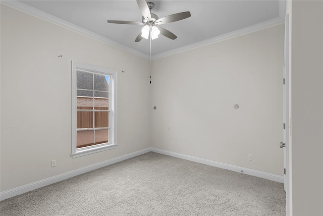 unfurnished room with ceiling fan, ornamental molding, and carpet floors