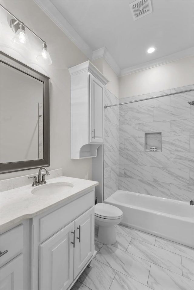 full bathroom with vanity, crown molding, toilet, and tiled shower / bath