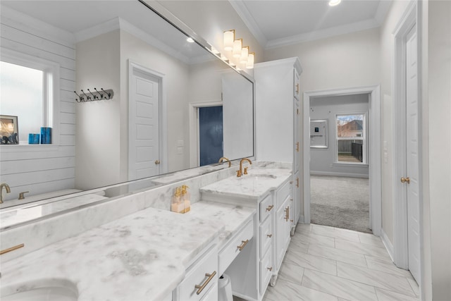 bathroom with ornamental molding and vanity