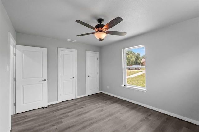 unfurnished bedroom featuring ceiling fan and light hardwood / wood-style flooring