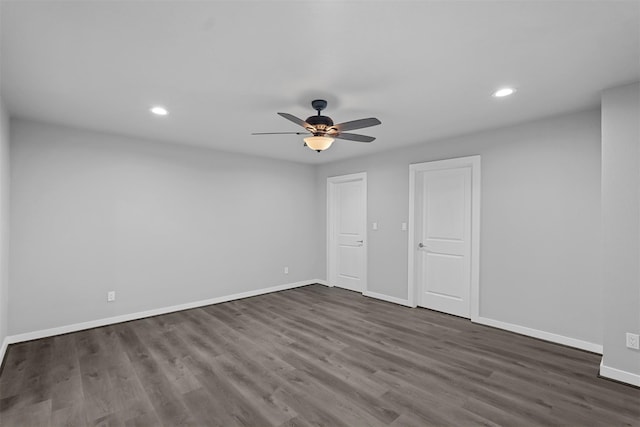 unfurnished bedroom with ceiling fan and dark hardwood / wood-style flooring