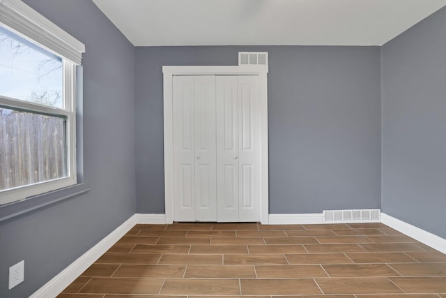 unfurnished bedroom featuring a closet