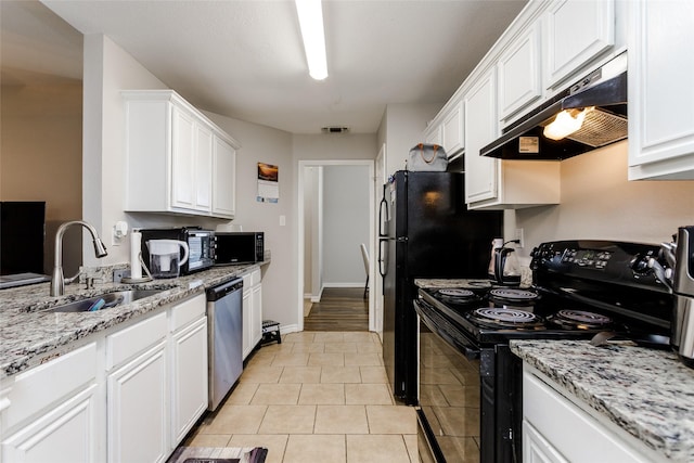 kitchen with black appliances, under cabinet range hood, white cabinetry, and a sink