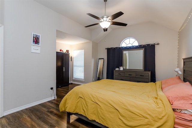 bedroom with lofted ceiling, ceiling fan, dark wood-type flooring, and baseboards