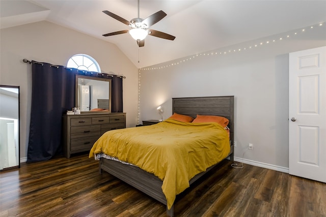 bedroom featuring lofted ceiling, dark wood-style flooring, a ceiling fan, and baseboards