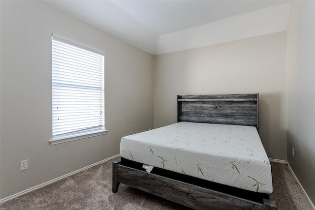 bedroom featuring carpet and baseboards