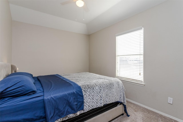 carpeted bedroom featuring ceiling fan and baseboards