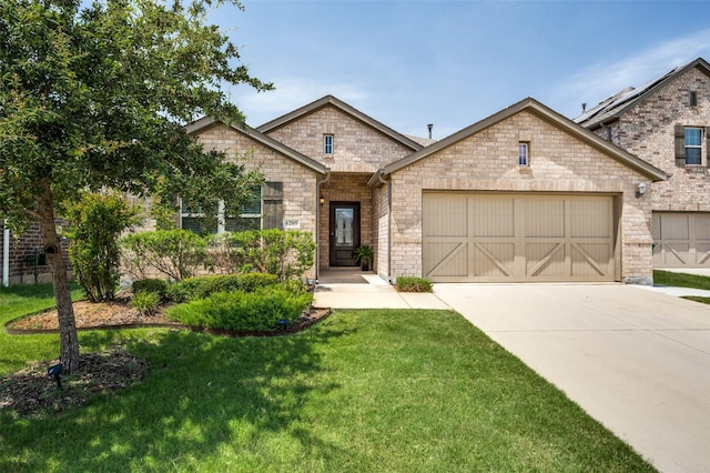 craftsman-style home featuring a garage and a front yard