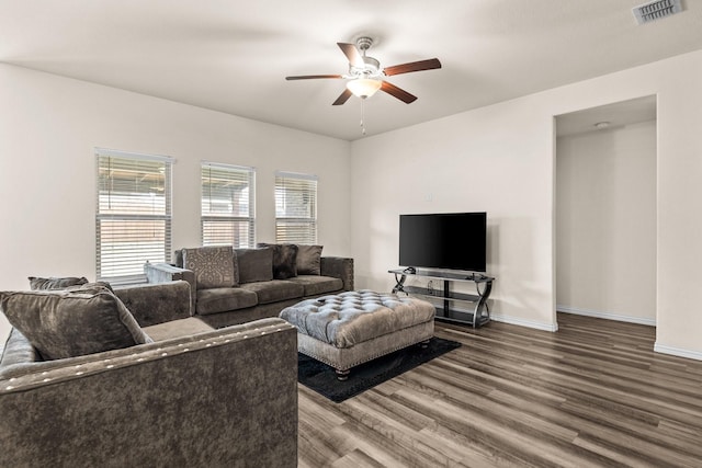 living room with hardwood / wood-style flooring and ceiling fan