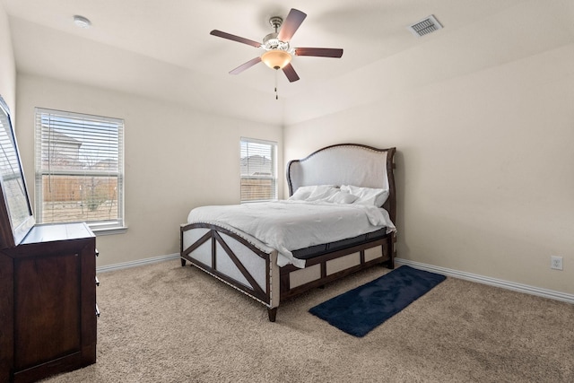 bedroom featuring light carpet and ceiling fan