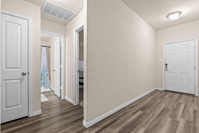 foyer entrance with dark hardwood / wood-style flooring