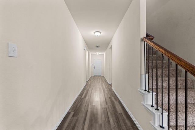 corridor featuring wood-type flooring