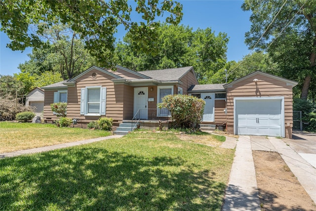 single story home with a garage and a front lawn