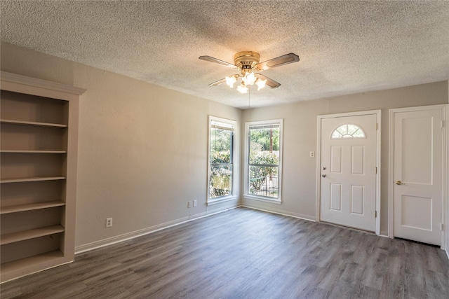 foyer with ceiling fan, hardwood / wood-style floors, and a textured ceiling