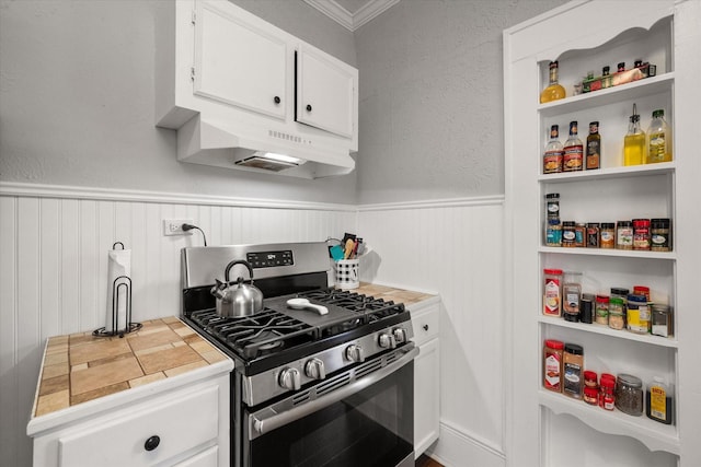 kitchen featuring tile countertops, stainless steel range with gas stovetop, and white cabinets