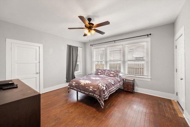 bedroom featuring dark hardwood / wood-style flooring and ceiling fan