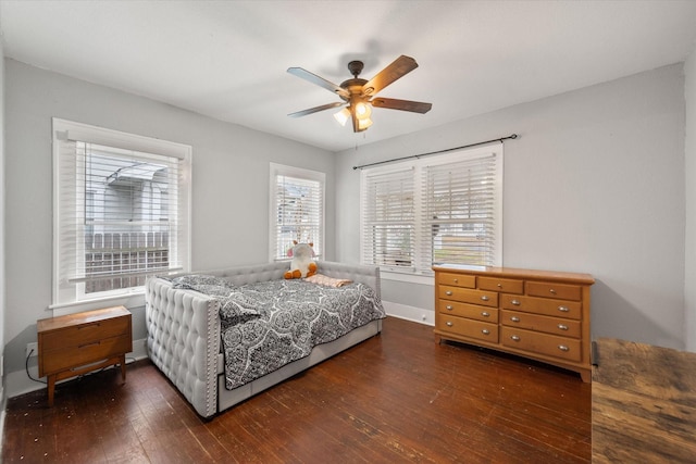 bedroom featuring ceiling fan and dark hardwood / wood-style floors