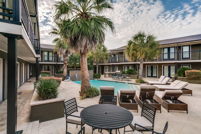 view of pool with a patio area