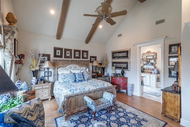 bedroom with ceiling fan, beam ceiling, high vaulted ceiling, and light hardwood / wood-style flooring