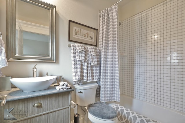 full bathroom with vanity, shower / bath combo with shower curtain, and toilet