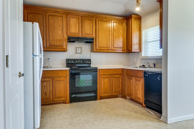 kitchen with sink and black appliances