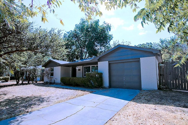 ranch-style house featuring a garage