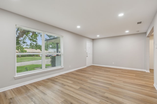 spare room featuring light hardwood / wood-style flooring