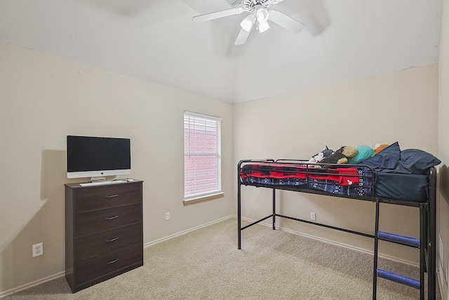 bedroom with ceiling fan, light colored carpet, and vaulted ceiling