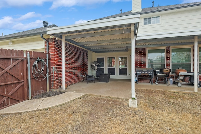 rear view of property featuring a patio area