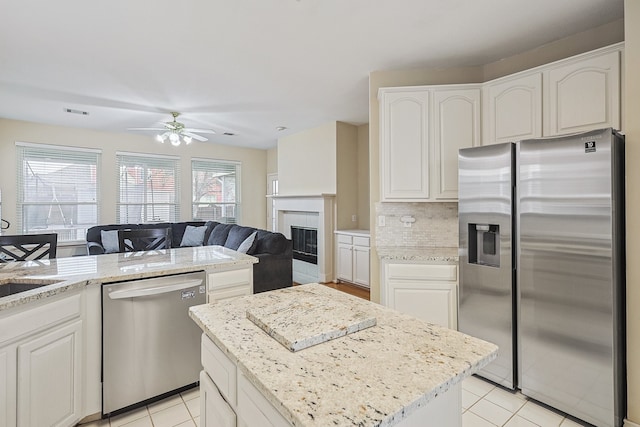 kitchen featuring stainless steel appliances and white cabinets