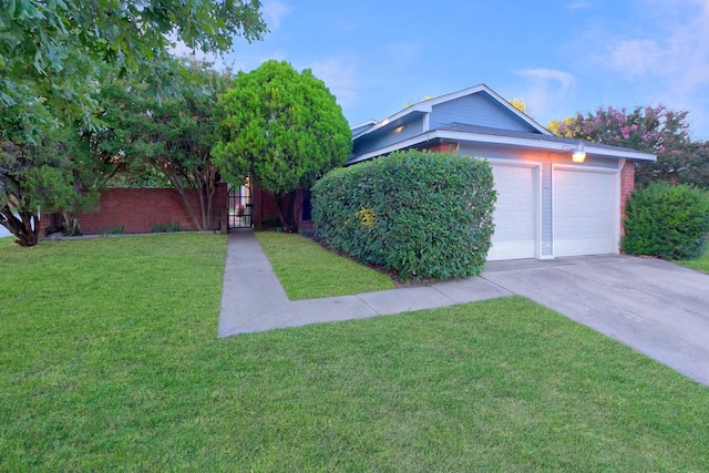 view of front of house with a garage and a front yard