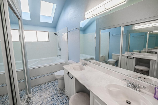 bathroom featuring vanity, toilet, tile patterned flooring, and lofted ceiling with skylight