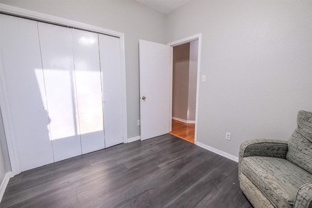 unfurnished room with dark wood-type flooring