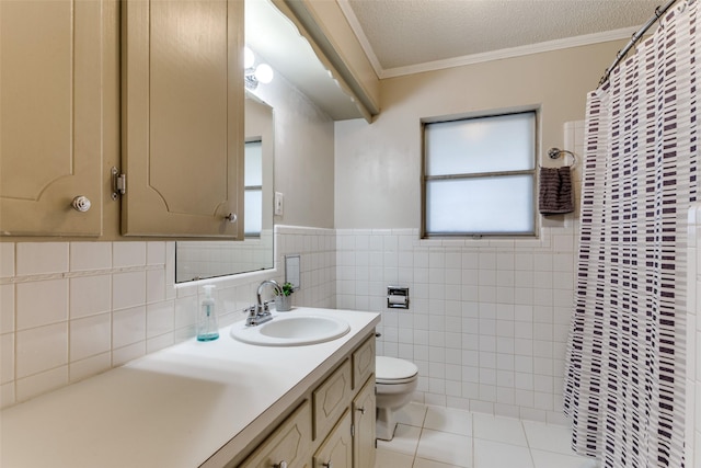 bathroom with tile patterned floors, toilet, a textured ceiling, ornamental molding, and vanity