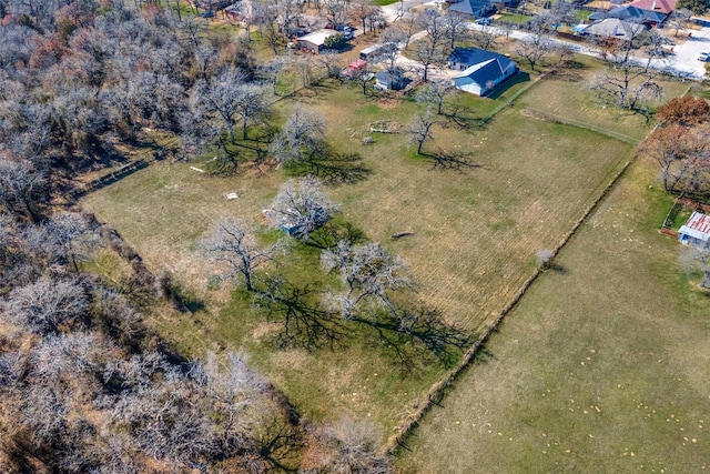 birds eye view of property with a rural view