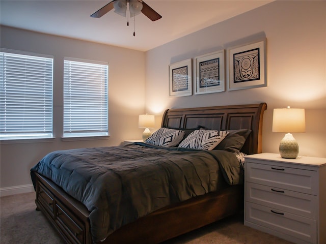 carpeted bedroom featuring ceiling fan and baseboards