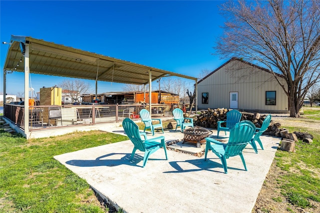 view of patio / terrace with an outdoor fire pit