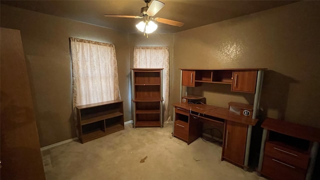 office space featuring ceiling fan and light colored carpet