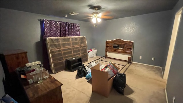 bedroom with light carpet and ceiling fan